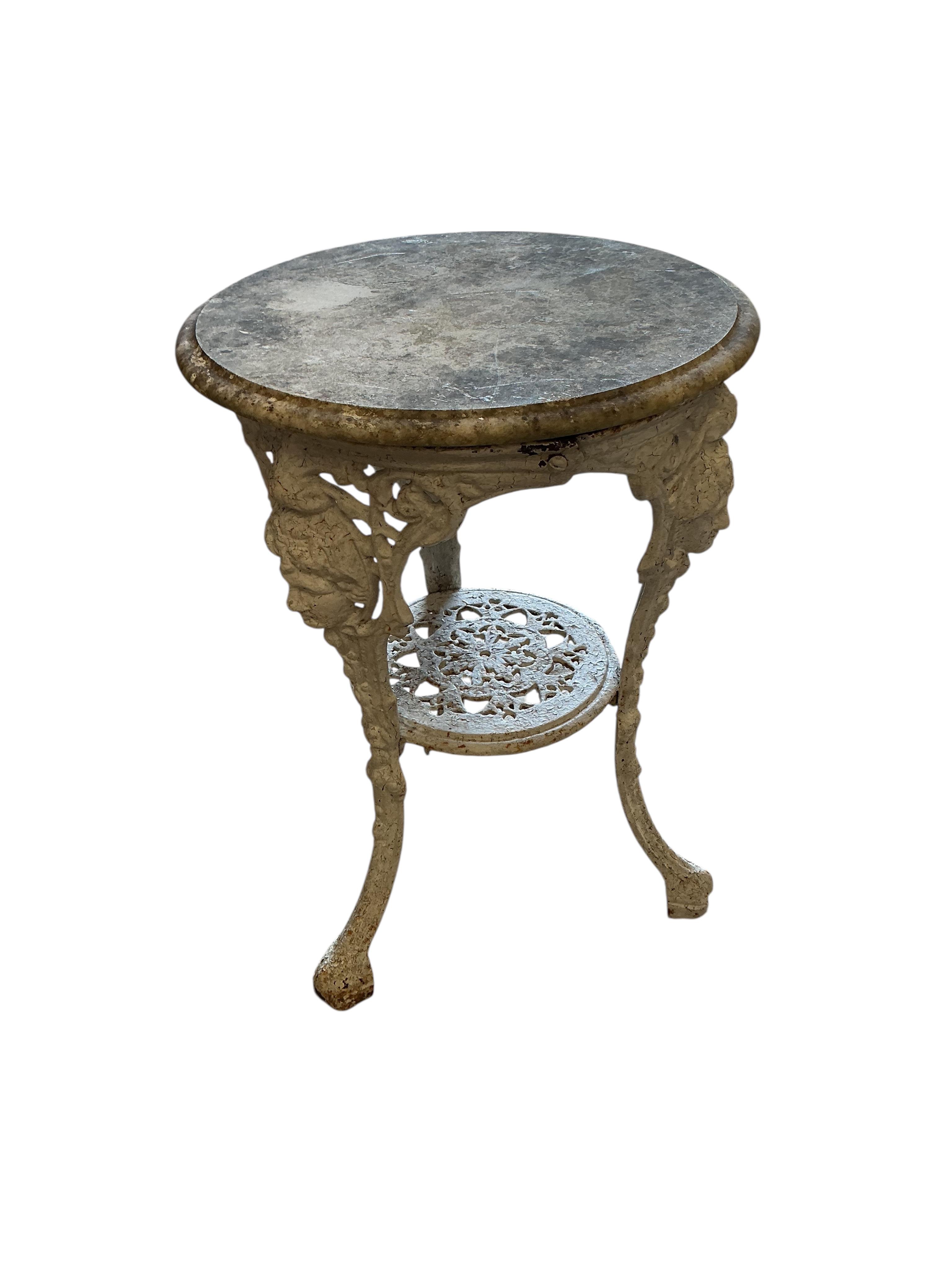 A Victorian cast iron circular marble top table, diameter 50cm, height 70cm